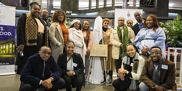 Members of Es'kia Mphahlele's family with the unveiled gold plaque